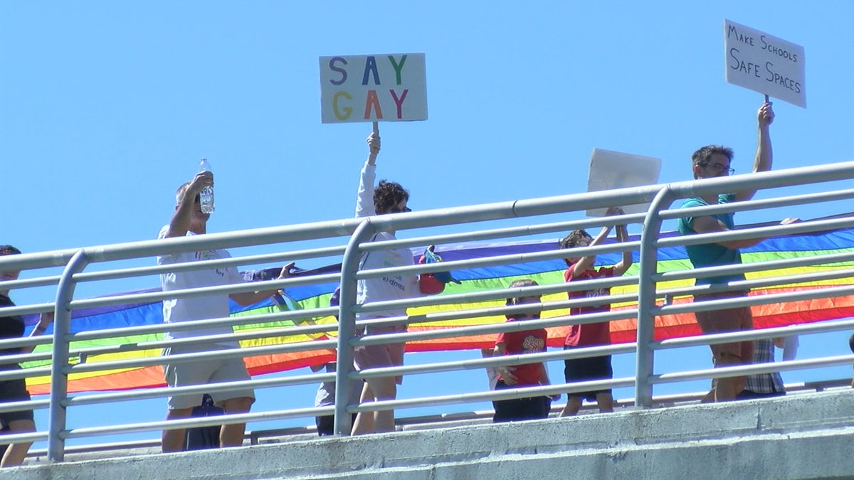 Hundreds of people gathered to express frustration after "Don't Say Gay" bill was approved in a...
