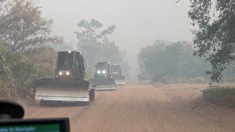 Florida Forest Service crews work to contain the blaze.
