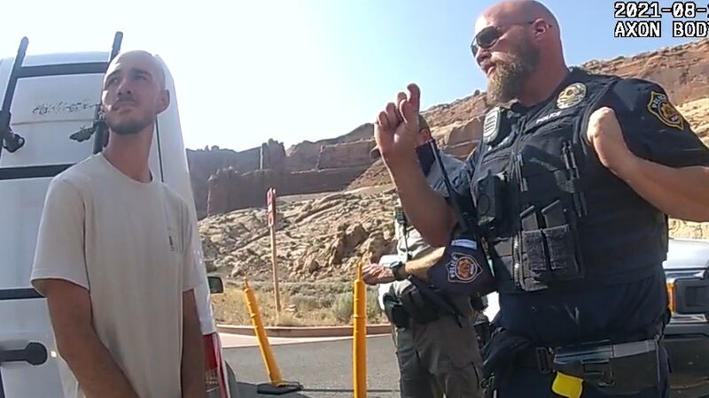 North Port, Florida, resident Brian Laundrie talks with Moab, Utah police officers Aug. 12 as...