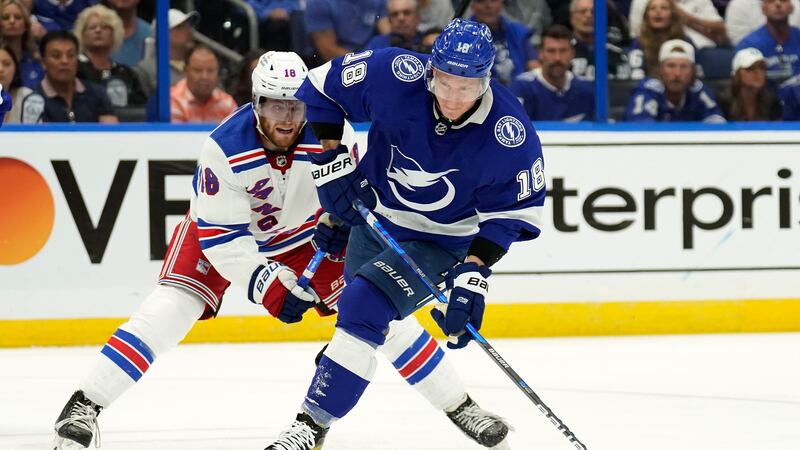 Tampa Bay Lightning left wing Ondrej Palat (18, right,) shoots after getting around New York...
