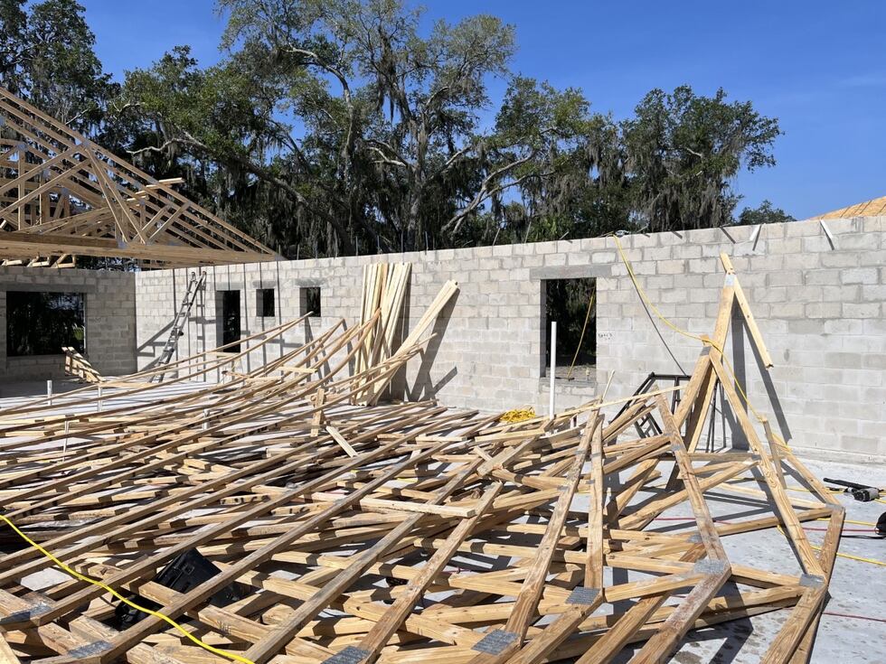 Two workers were injured June 23 when the truss they were standing on collapsed.