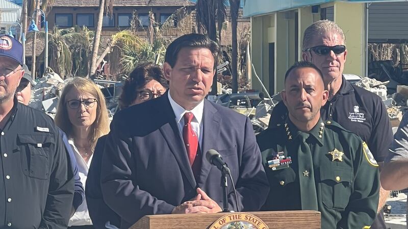 Gov. Ron DeSantis speaks at a news conference in Fort Myers Beach Oct. 16.