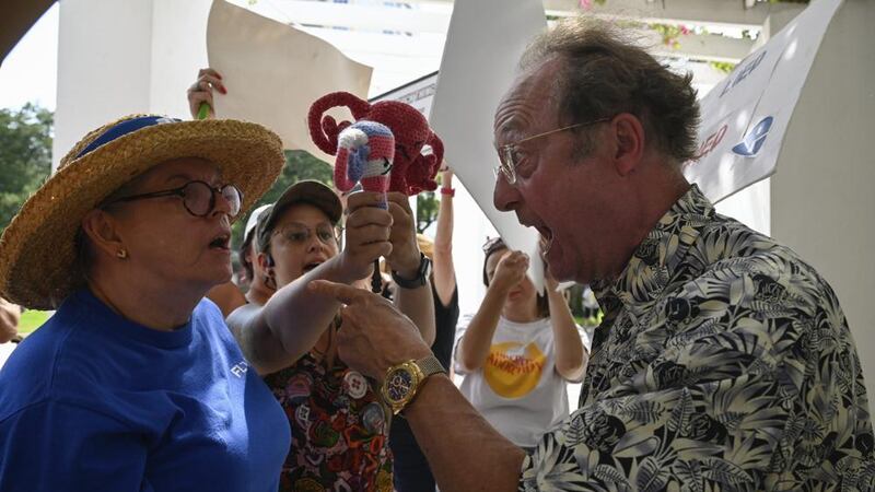 Protesters and a counter protester get into a debate about abortion rights on Friday, June 24,...