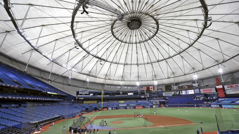Members of the Tampa Bay Rays take batting practice at Tropicana Field before a baseball game...