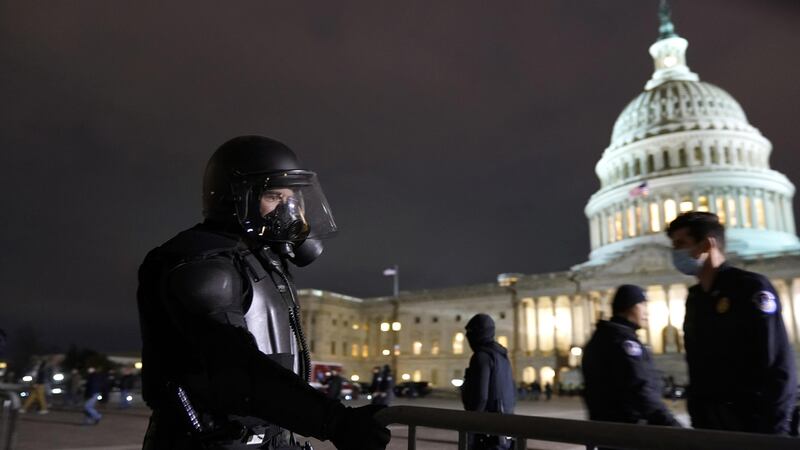 Authorities secure the area outside the U.S. Capitol, Wednesday, Jan. 6, 2021, in Washington.