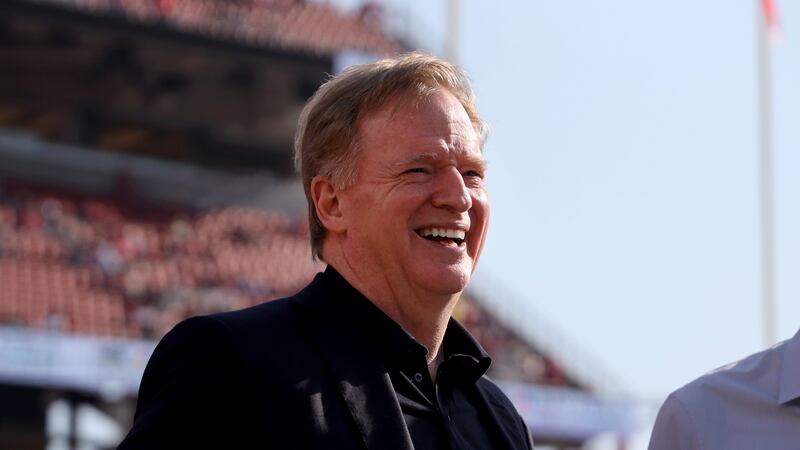 NFL commissioner Roger Goodell walks on the sideline during an NFL football game between the...