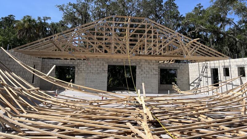 The truss of a new home under construction in Parrish collapsed June 23, sending two workers...