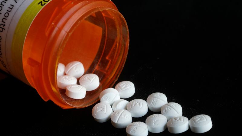 FILE - This Aug. 29, 2018, file photo shows an arrangement of prescription oxycodone pills in...