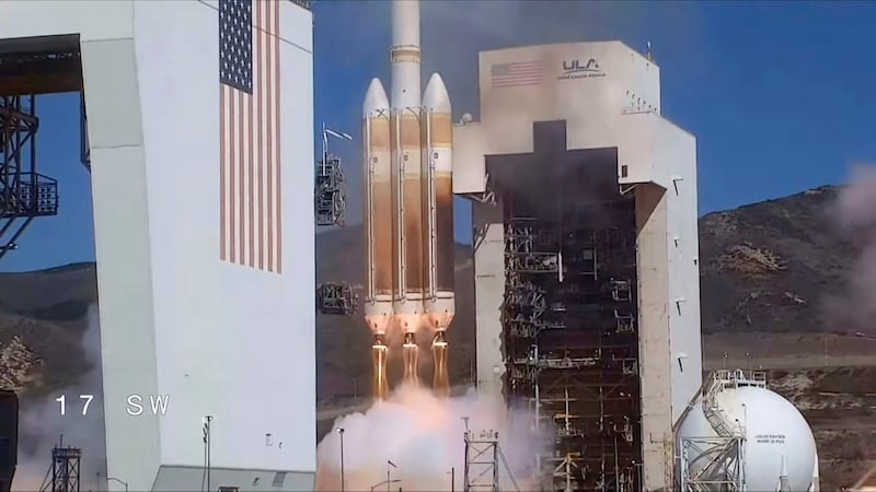In this photo released by United Launch Alliance, a classified satellite for the U.S. National...