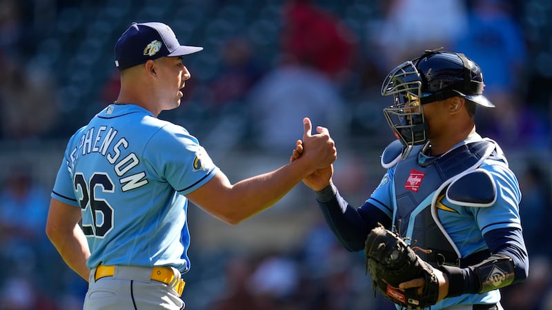 Tampa Bay Rays relief pitcher Robert Stephenson (26) and catcher Christian Bethancourt...