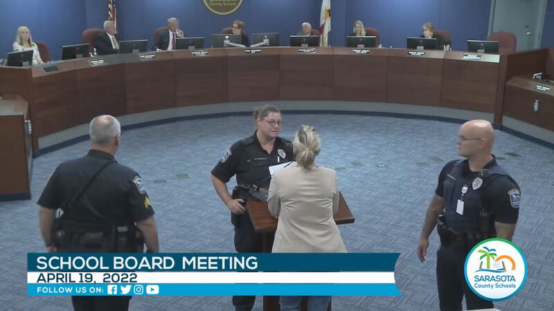 Woman escorted out of school board meeting in Sarasota following heated exchange.