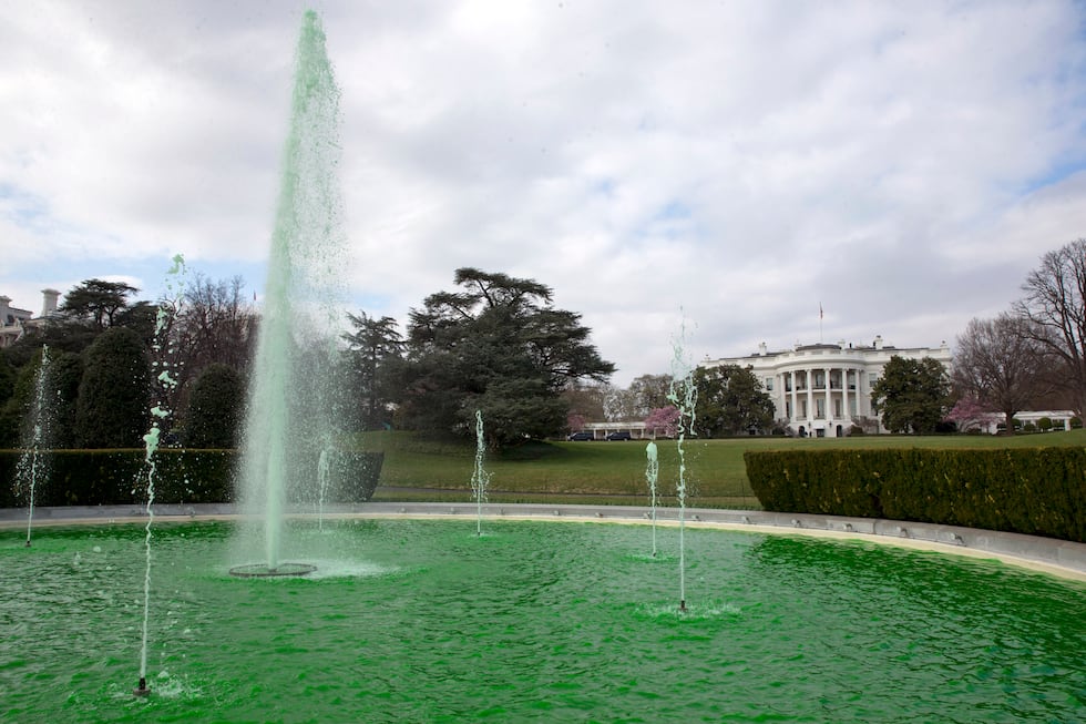 FILE - The fountain on the South Lawn of the White House is dyed green in honor of St....