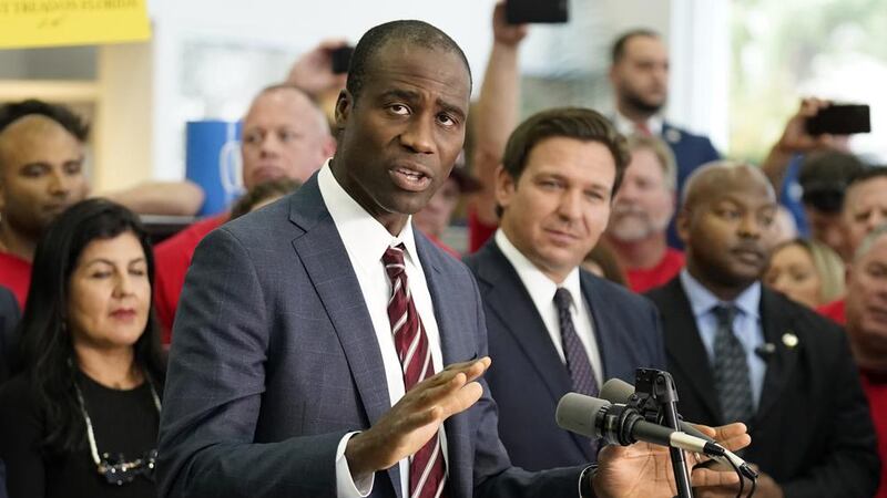 Florida Surgeon General Dr. Joseph Ladapo gestures as speaks to supporters and members of the...