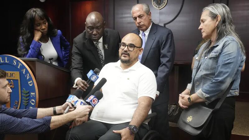 Michael Ortiz speaks at a news conference regarding a lawsuit against a police officer...