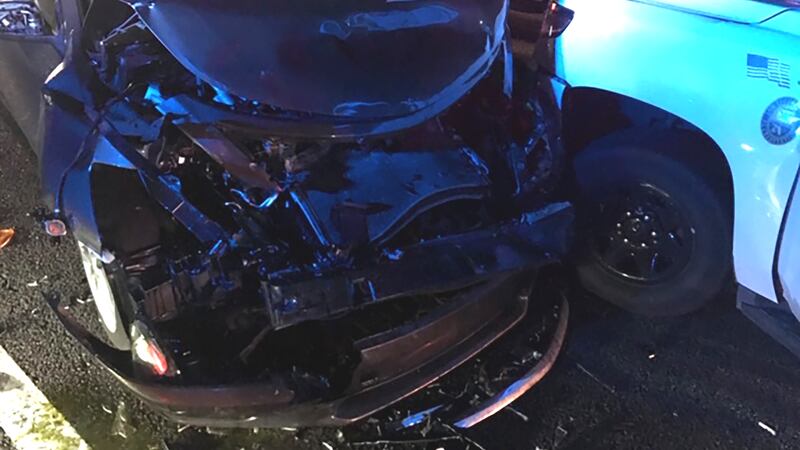 A woman was arrested after crashing into a Sarasota Deputy's cruiser.