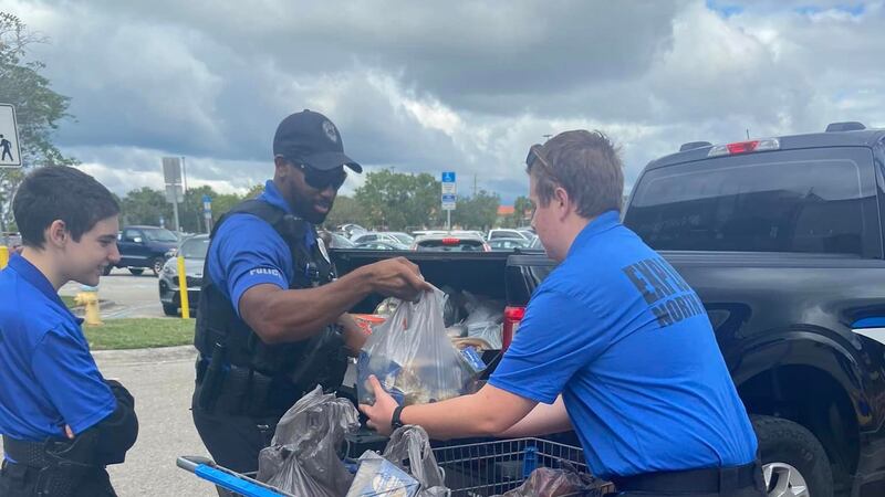 NPPD's Community Policing Unit filling up a truckload of food.